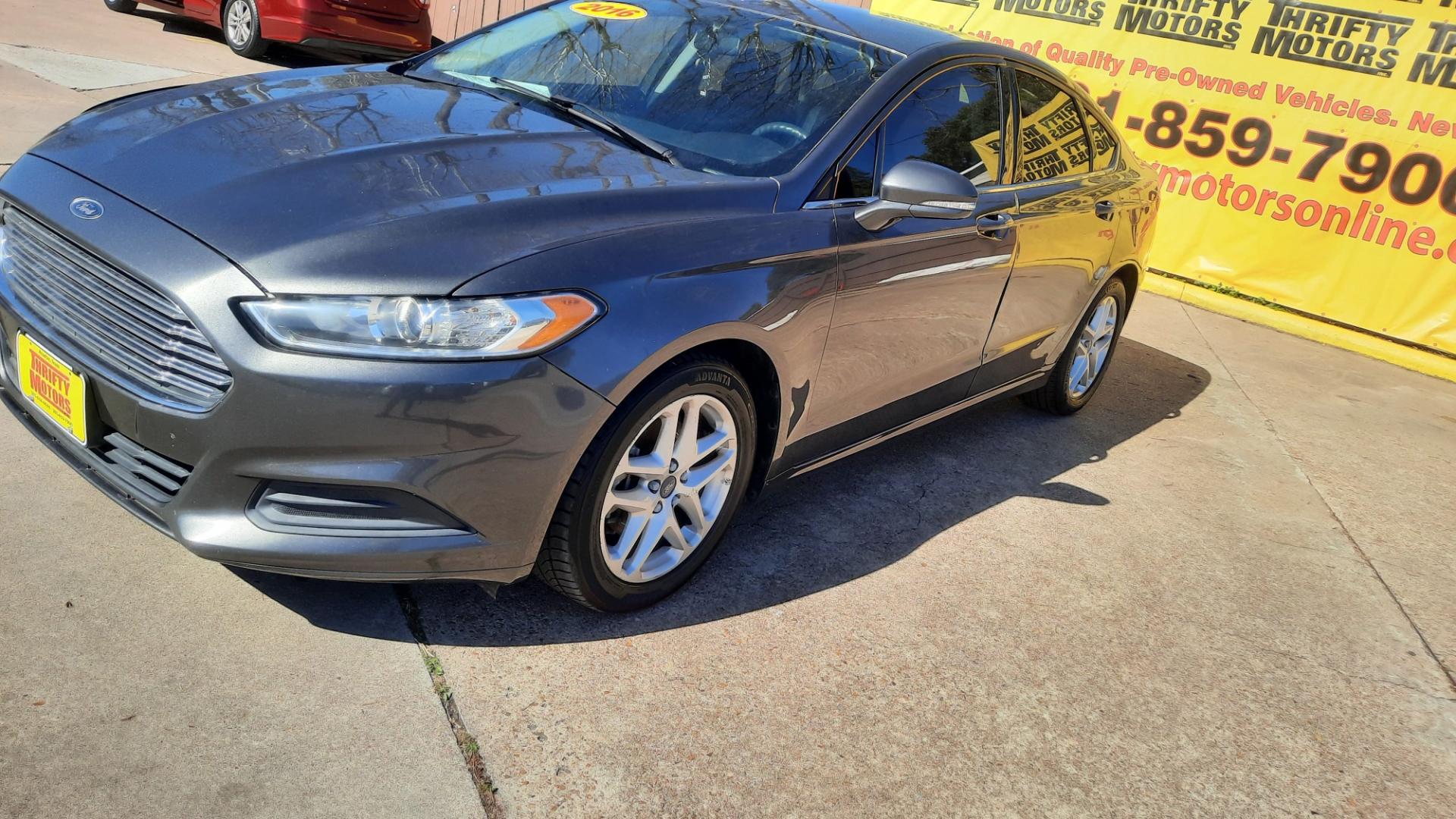 2016 Ford Fusion (3FA6P0HD5GR) , located at 16710 Clay Rd., Houston, TX, 77084, (281) 859-7900, 29.834864, -95.656166 - Photo#0